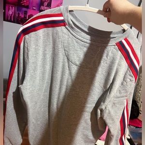 grey crewneck with striped sleeves